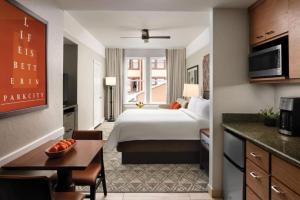 a hotel room with a bed and a kitchen at Marriott Summit Watch Luxury Studio in Park City