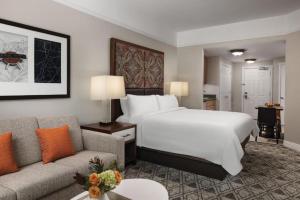 a hotel room with a bed and a couch at Marriott Summit Watch Luxury Studio in Park City
