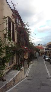 a building with flowers on the side of a street at Atelier in Rethymno