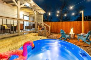 a pink toy duck sitting in a swimming pool at Southtown 3BR Cowboy Pool, Playset, Riverwalk, BBQ, Firepit, Big Yard — Downtown San Antonio in San Antonio