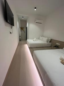 Postel nebo postele na pokoji v ubytování SWM Hotel