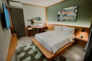 Voodi või voodid majutusasutuse Jiro Hotel toas