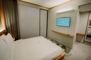 Voodi või voodid majutusasutuse Jiro Hotel toas