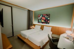 Voodi või voodid majutusasutuse Jiro Hotel toas