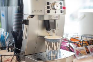 a coffee machine sitting on top of a counter at Uwajima Oriental Hotel in Uwajima