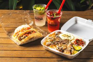 a table with a tray of food and two drinks at BEB5 Okinawa Seragaki by Hoshino Resorts in Onna