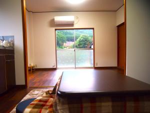 Postel nebo postele na pokoji v ubytování 那智の里 Accommodation along the Kumano Kodo trail