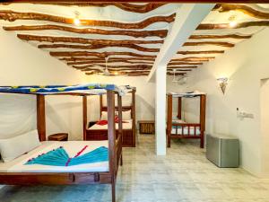 Letto o letti in una camera di Sagando Bungalows Zanzibar