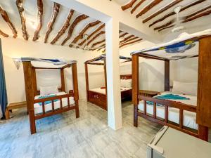 Letto o letti in una camera di Sagando Bungalows Zanzibar
