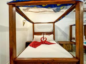 Letto o letti in una camera di Sagando Bungalows Zanzibar