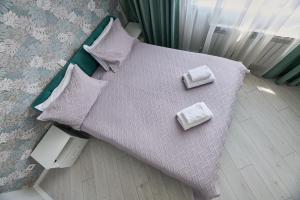 Postel nebo postele na pokoji v ubytování One Bedroom Apartment Next to Arbat In The Center of Almaty