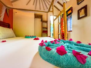 Letto o letti in una camera di Sagando Bungalows Zanzibar