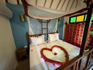 Letto o letti in una camera di Sagando Bungalows Zanzibar