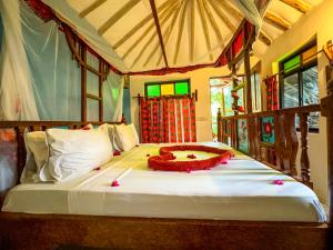 Letto o letti in una camera di Sagando Bungalows Zanzibar
