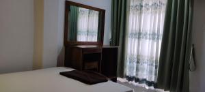 Postel nebo postele na pokoji v ubytování Empire Valley Hotel