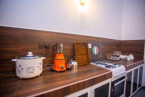a kitchen with a stove and a blender on a counter at 2BR Family Getaway Hikkaduwa- Sleep 6 - Surfing- Bikes and airport drop-off in Hikkaduwa