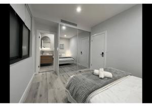 En eller flere senge i et værelse på Macquarie Guest House