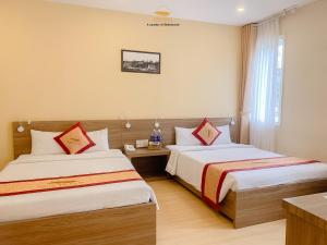 Postel nebo postele na pokoji v ubytování Nice Dream Hotel