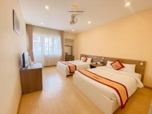 Postel nebo postele na pokoji v ubytování Nice Dream Hotel