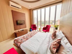 Hotel Pearl Grand-Family Hotel-Feel Like home客房内的一张或多张床位