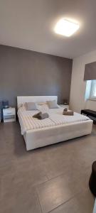 Кровать или кровати в номере Apartment "MANNA