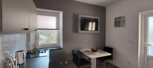 Телевизор и/или развлекательный центр в Apartment "MANNA