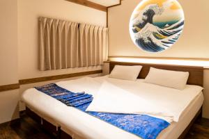 Postel nebo postele na pokoji v ubytování 都電屋 TodenHotel