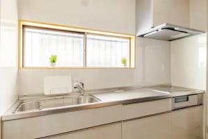 Η κουζίνα ή μικρή κουζίνα στο 池袋駅まで徒歩15分 畳の家 +24 φωτογραφίες