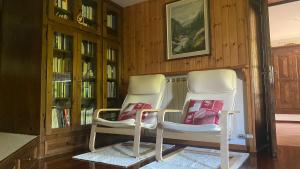 Posezení v ubytování Appartamenti Maison Guyon