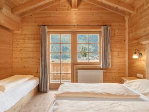 Postel nebo postele na pokoji v ubytování Chalets Huber