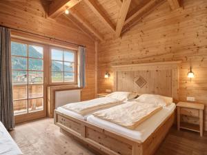 Postel nebo postele na pokoji v ubytování Chalets Huber
