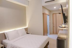 Krevet ili kreveti u jedinici u okviru objekta Sajiwa Inn and Suite Hotel