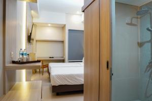 Krevet ili kreveti u jedinici u okviru objekta Sajiwa Inn and Suite Hotel