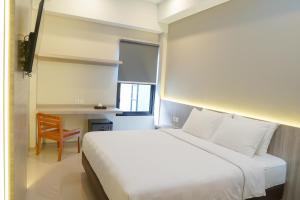 Krevet ili kreveti u jedinici u okviru objekta Sajiwa Inn and Suite Hotel
