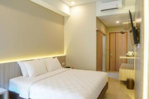 Krevet ili kreveti u jedinici u okviru objekta Sajiwa Inn and Suite Hotel