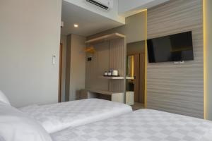 Krevet ili kreveti u jedinici u okviru objekta Sajiwa Inn and Suite Hotel