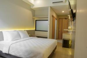 Krevet ili kreveti u jedinici u okviru objekta Sajiwa Inn and Suite Hotel