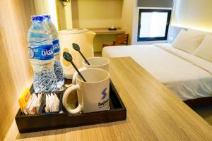 Krevet ili kreveti u jedinici u okviru objekta Sajiwa Inn and Suite Hotel