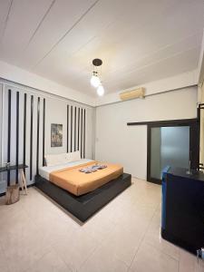 Postel nebo postele na pokoji v ubytování Natai House