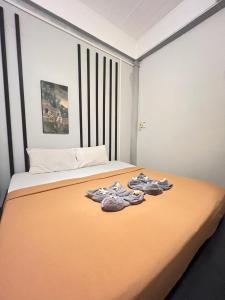 Postel nebo postele na pokoji v ubytování Natai House