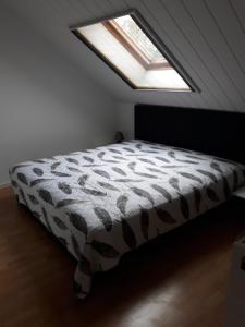 a bedroom with a bed in a room with a window at Zum Harzblick in Seesen