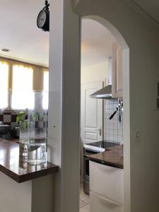 Kuchyň nebo kuchyňský kout v ubytování Expérience Inouïe à Orléans ! + 35 fotografií