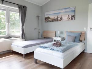 Postel nebo postele na pokoji v ubytování triple a³