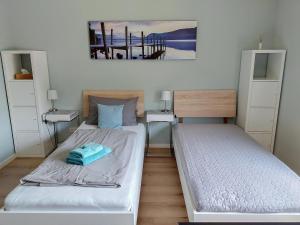 Postel nebo postele na pokoji v ubytování triple a³