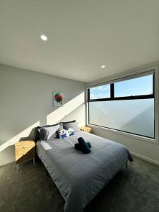 Ένα ή περισσότερα κρεβάτια σε δωμάτιο στο Bespoke Family Sanctuary