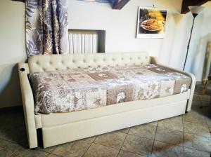 a bed in a room with a bed frame at Orto del pettirosso Appartamento con piscina privata e BBQ in Front +31 photos