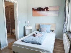 Postel nebo postele na pokoji v ubytování triple a³