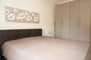 Postel nebo postele na pokoji v ubytování Filios Apartment