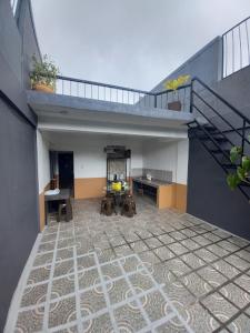 a view of a room with a staircase and a patio at Jil's Apartelle in Tagaytay