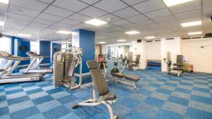 a gym with treadmills and elliptical machines at ESTIMAR Calpe Apartments in Calpe